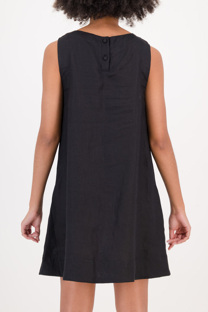 Woman wearing black Mia Dress facing backwards